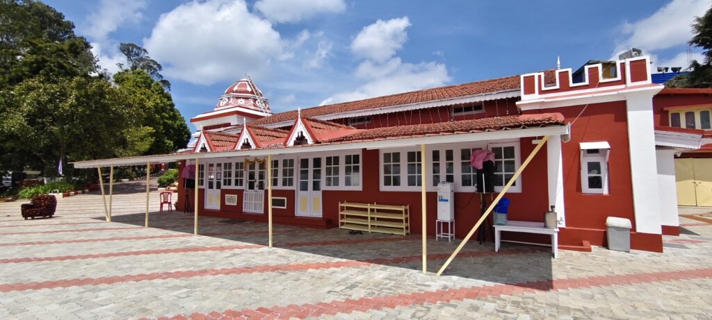 Ramakrishna Math Ooty courtyard with red building and tiled pathway
