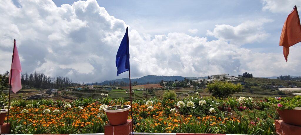 Ramakrishna Math Ooty building with flowers and mountain view