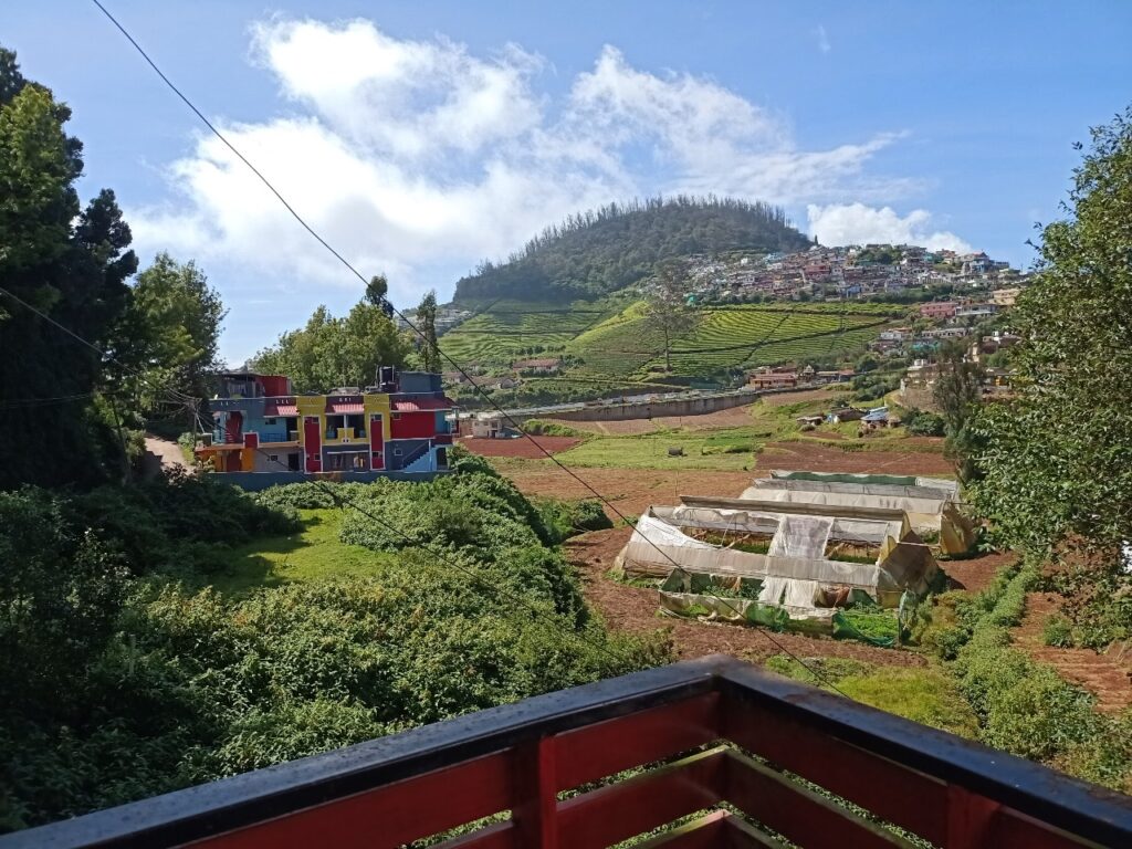 Scenic Ooty valley view from a cottage balcony