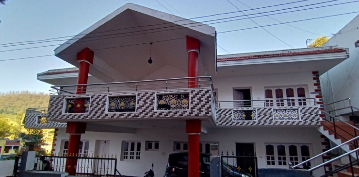 Exterior night view of a 3-bedroom cottage