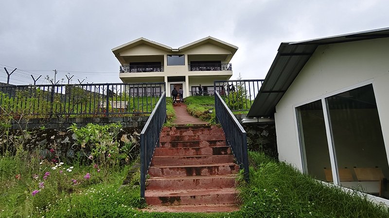 Aakran Cottage building front view with balconies