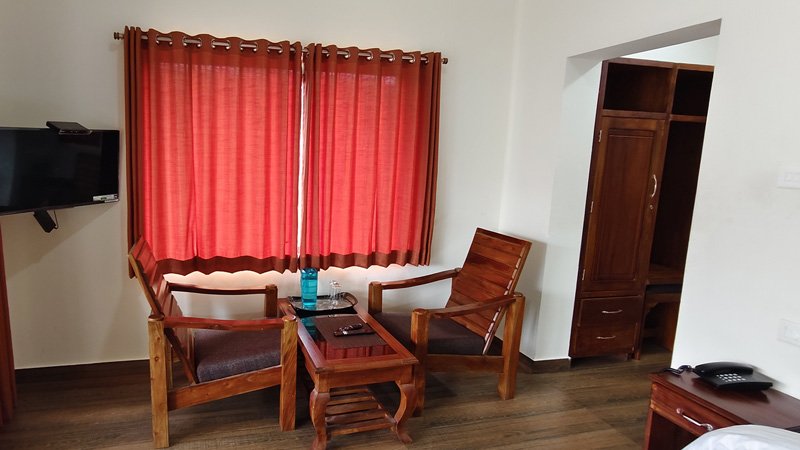 Aakran Cottage living area with wooden chairs