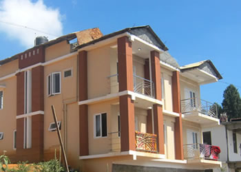 Modern exterior of Abi Residency with multiple balconies and contemporary architecture