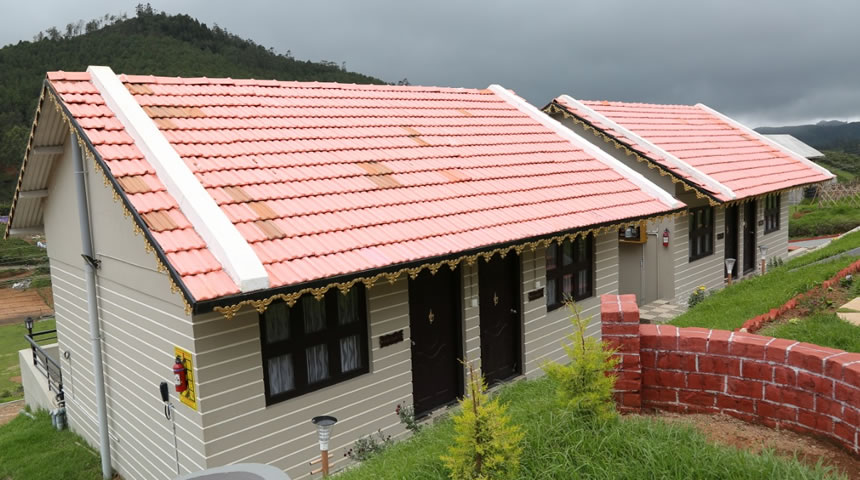 British style cottage in Ooty with sloped roof and scenic mountain surroundings