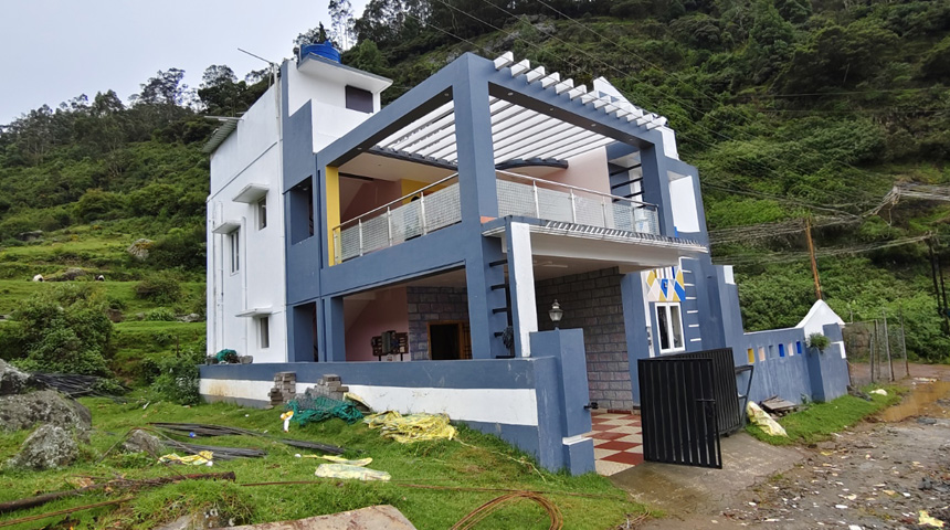 White Corner Cottage exterior with modern design in a scenic hillside location