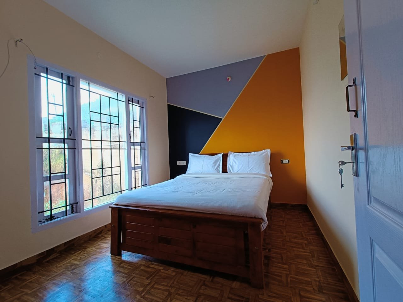 Bedroom featuring colorful modern wall design