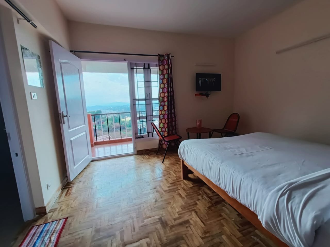 Bedroom with wide windows and fresh natural lighting