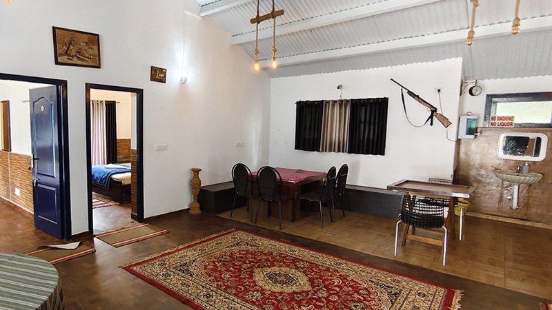 Indoor dining area with spacious hall layout, seating arrangement and wooden flooring interior