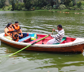 Boating in Ooty Lake with tourists enjoying a boat ride
