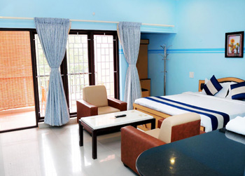 Spacious deluxe room with balcony and modern amenities