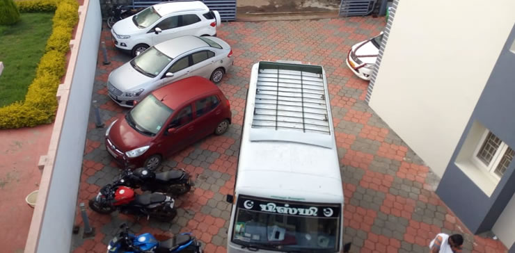 Private parking area with cars and bikes at cottage