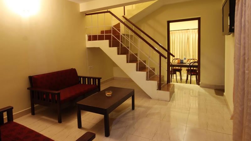 Spacious living room with stairs