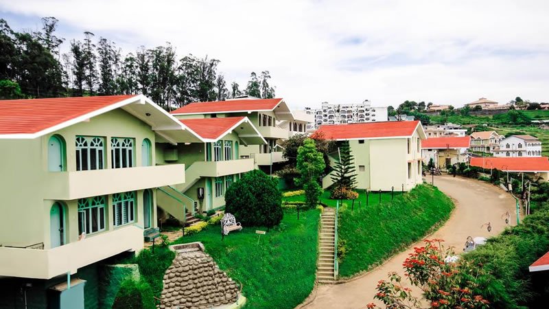 Hillside villa complex with gardens