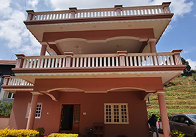 Luxury cottage in Ooty with spacious balconies, front garden, and parking area