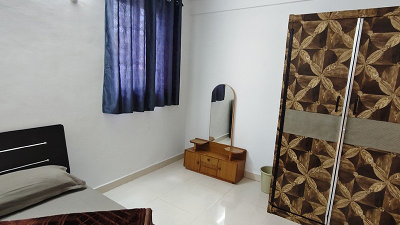 Bedroom with wardrobe and mirror table