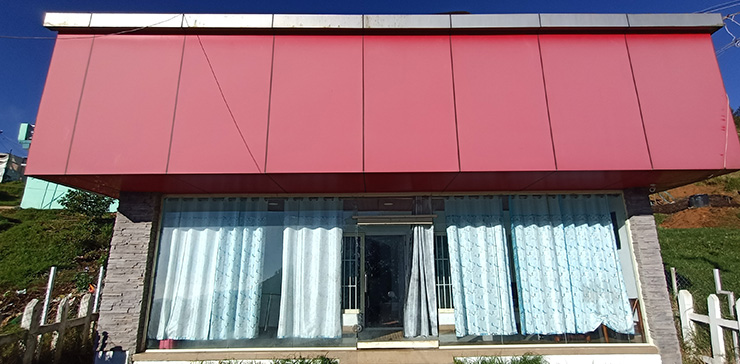 Mountain View Cottage exterior with modern design and scenic hill view