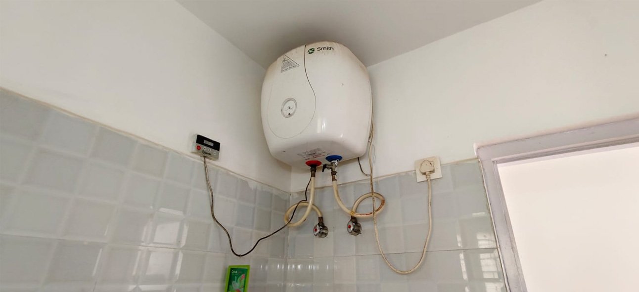 Wall-mounted water heater in the bathroom