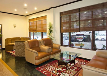 Luxury living room interior at Sunshine Inn Resort with comfortable seating and large windows