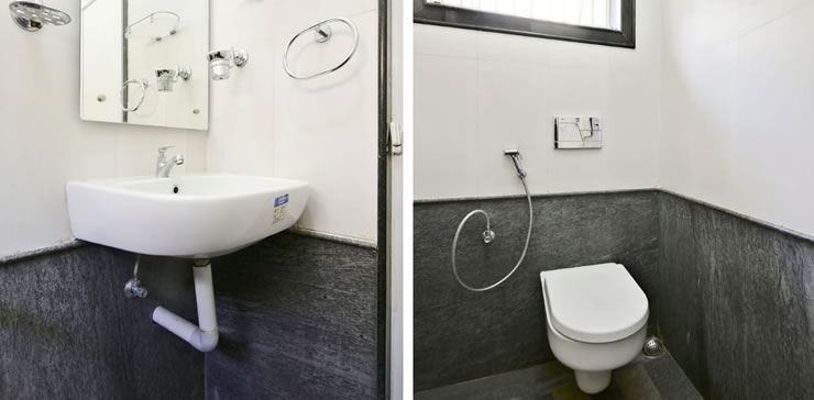 Modern bathroom with clean fixtures and shower at Toy Cottage