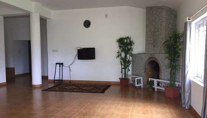 Hall and fire place at Vivin Cottage