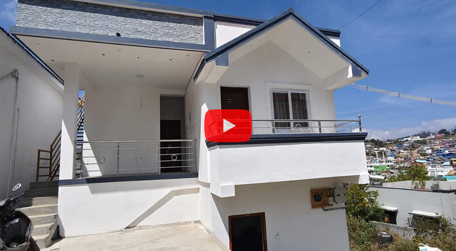 Modern white cottage with balcony railing and front stairs